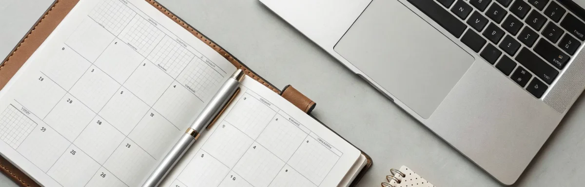 Planner and laptop organized for how to renew a CDA credential.