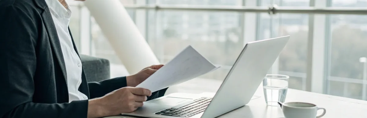 Professional at a laptop researching the best online CDA program.